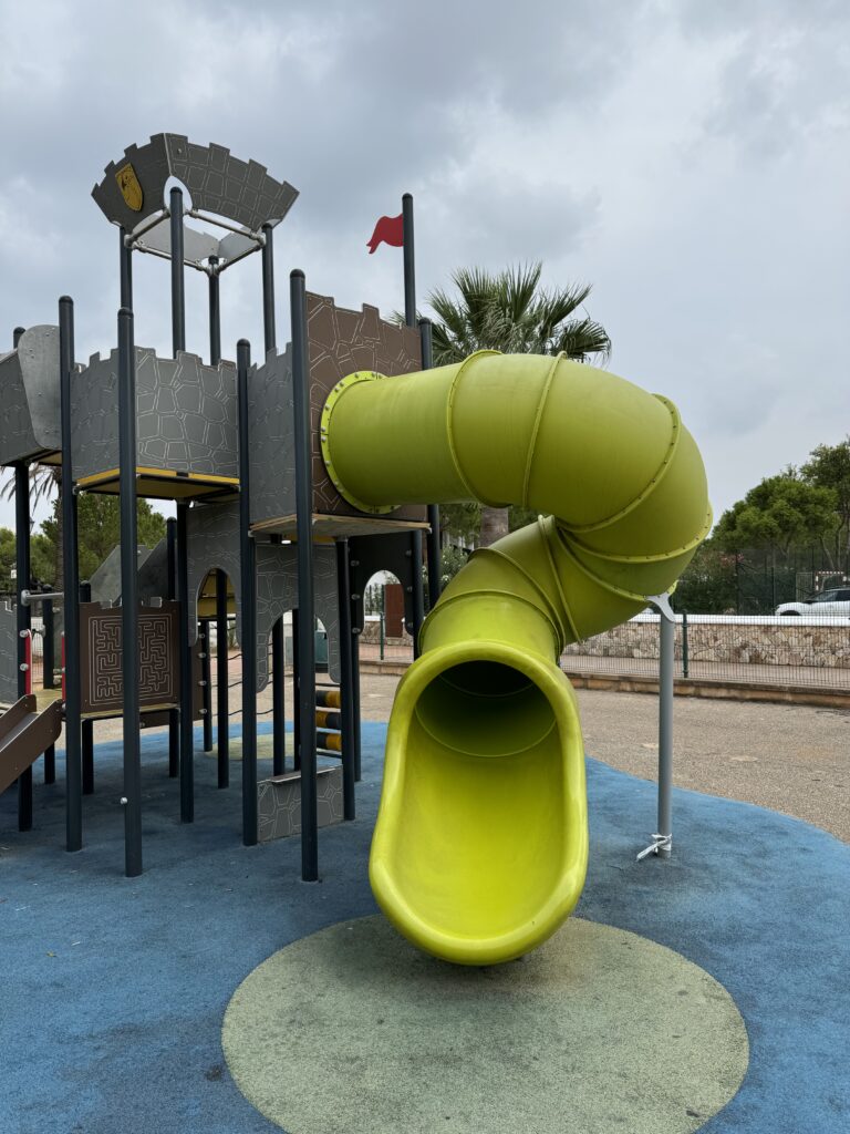 A playground with a large slide.