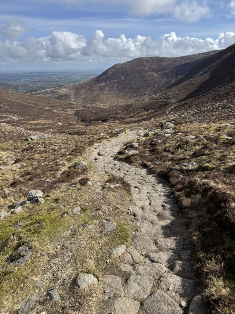 The Slieve Bearnagh Hike descending on a stone-pitched mountain path