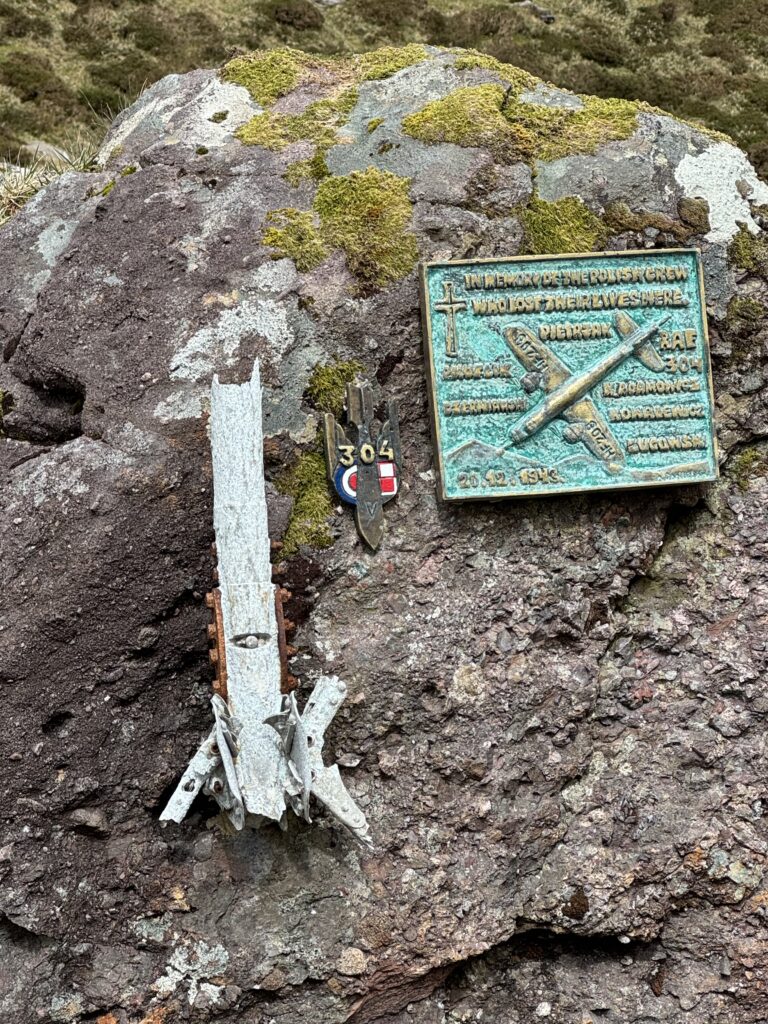 Memorial plaque and aircraft wreckage remembering the six Polish airmen killed in a Vickers Wellington crash in December 1943.