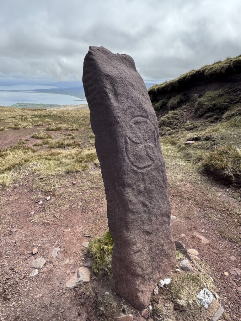 Arraglen Ogham Stone on the Masatiompan and Sauce Creek walk, with its ancient inscription and Brandon Bay visible behind.