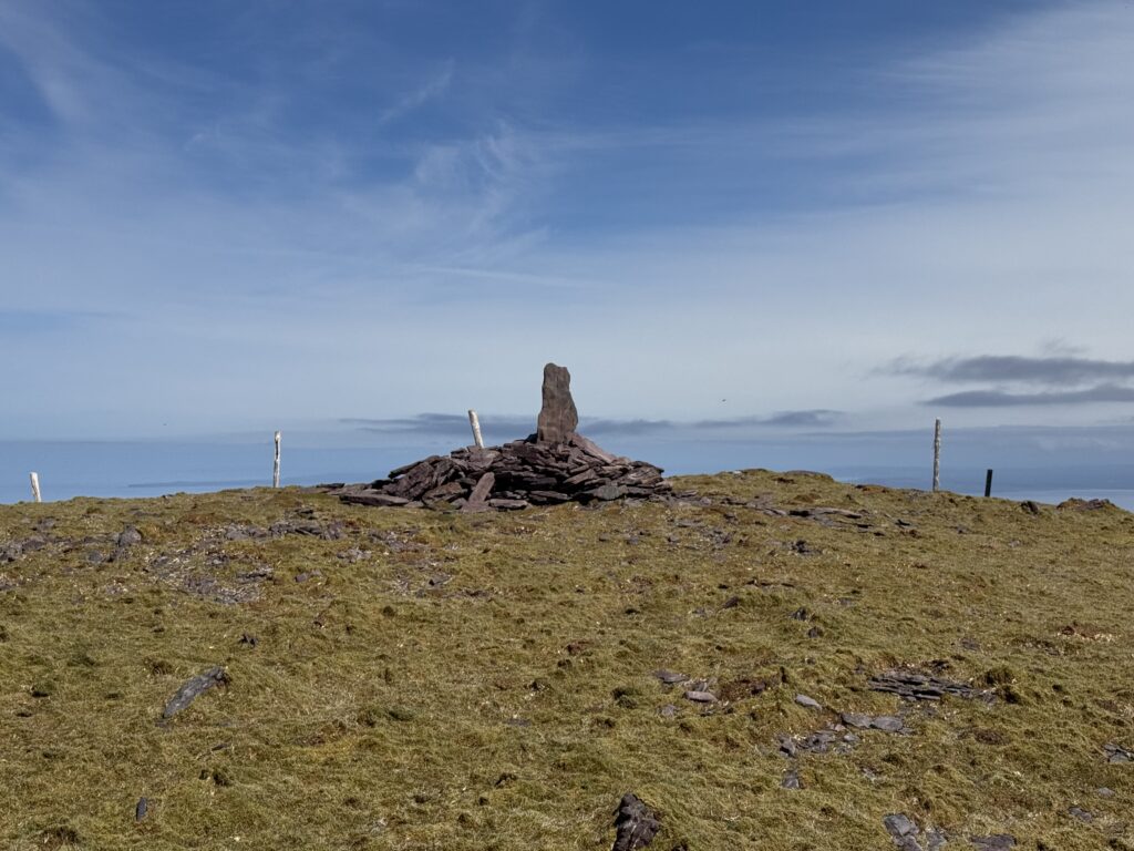 Stone cairn at the 762-metre summit of Masatiompan overlooking the Atlantic Ocean.