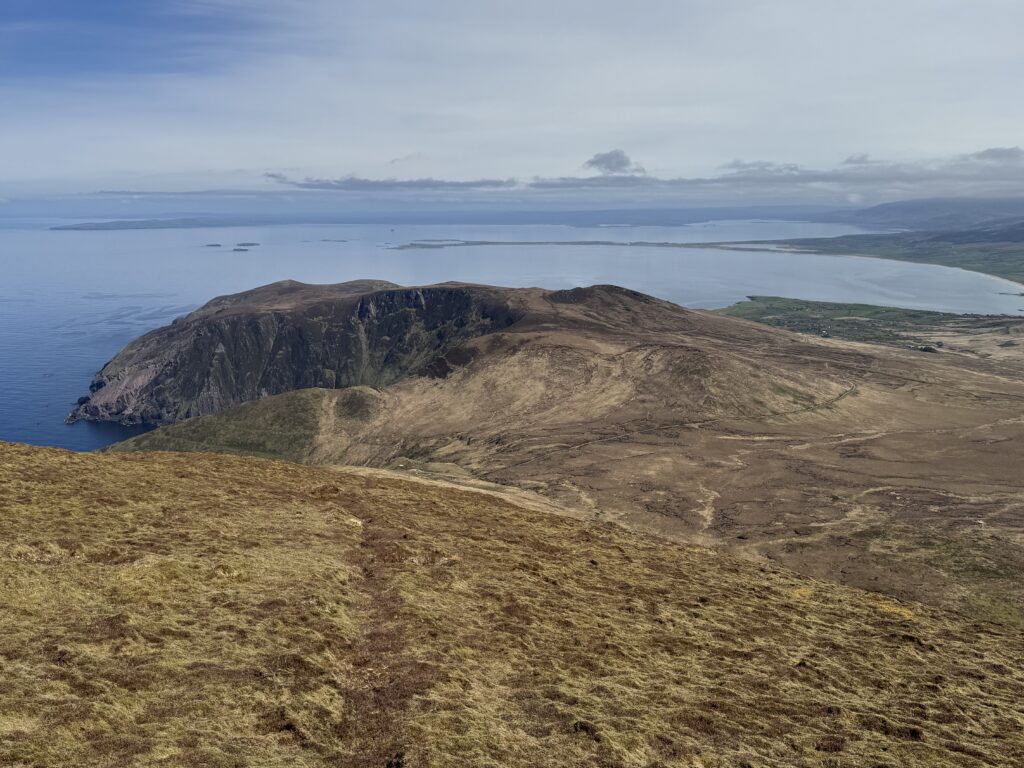 Panoramic views over Brandon Bay and the cliffs below from the Masatiompan and Sauce Creek walk on the Dingle Peninsula.