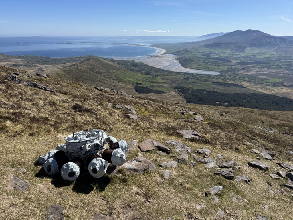 Aircraft engine wreckage beside the Mount Brandon Loop, overlooking Brandon Bay and the surrounding Dingle Peninsula countryside.