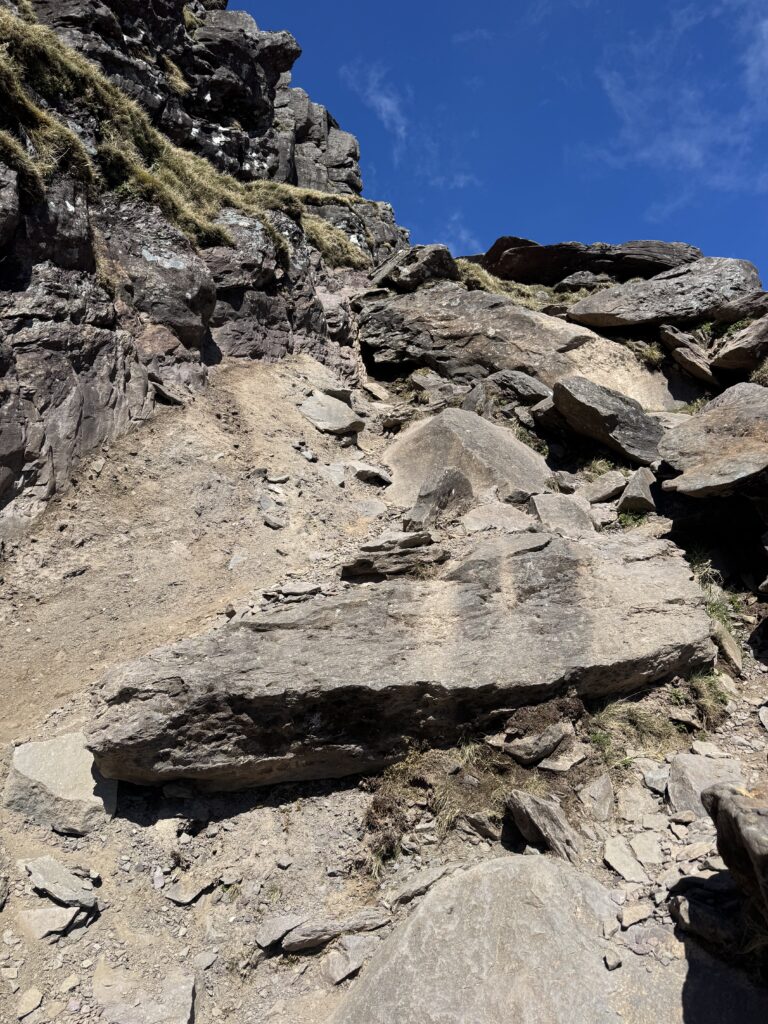 Rocky scrambling section on the steep climb through the Éisc towards Mount Brandon.