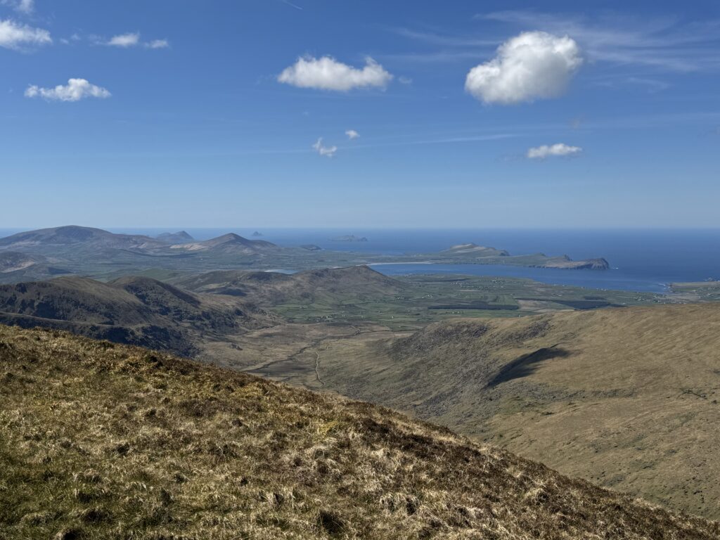 Panoramic mountain view across the western Dingle Peninsula towards the rugged Atlantic coastline.